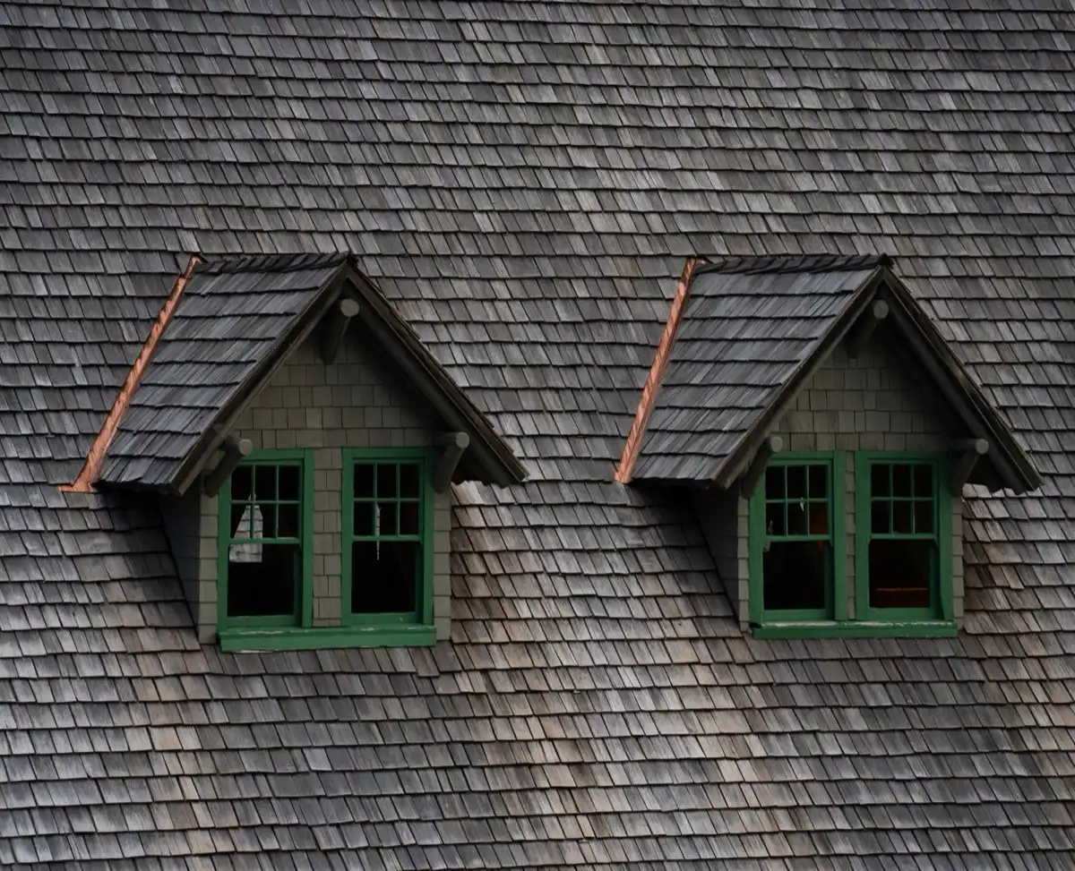 Dormers on a shingle roof in Fort Collins, CO, where step flashing and kickout flashing carry water past the walls